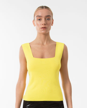 The yellow sleeveless top blouse