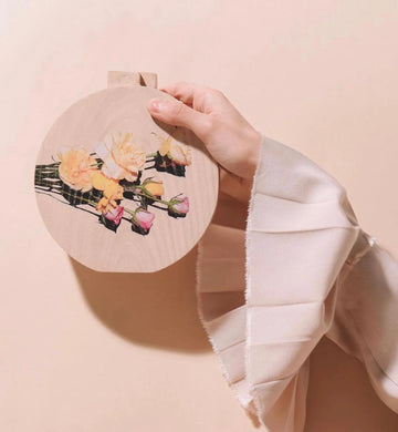 Round floral wooden clutch