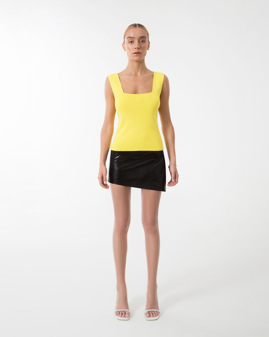The yellow sleeveless top blouse